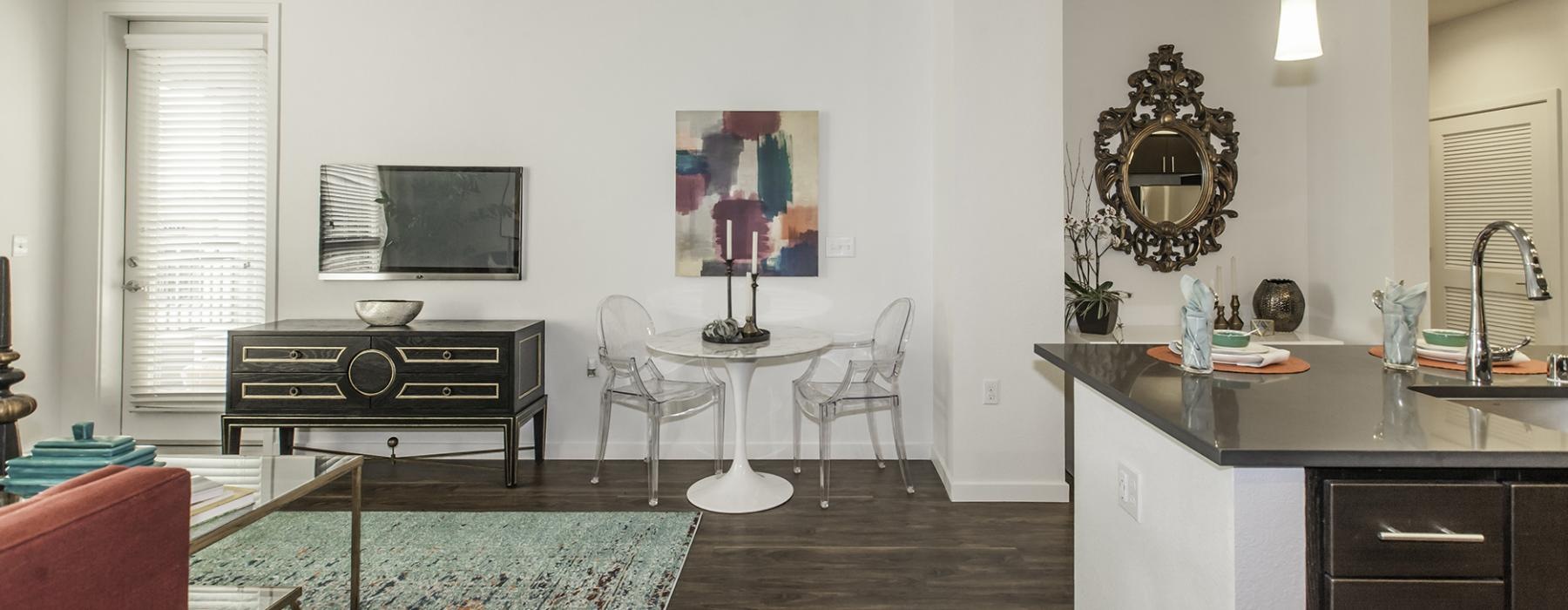 a living room with a piano and a table