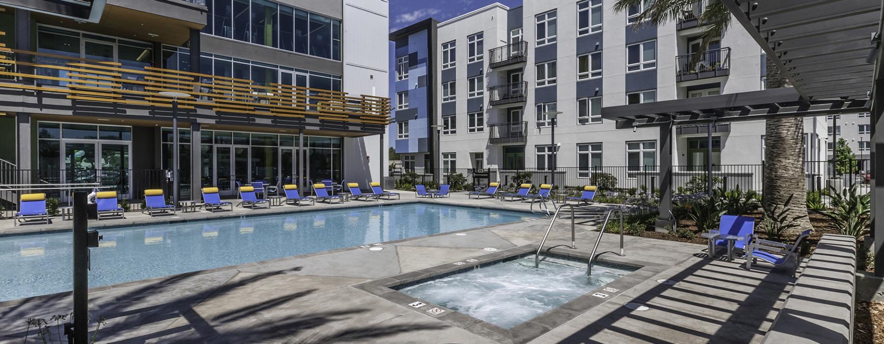 a pool with chairs around it